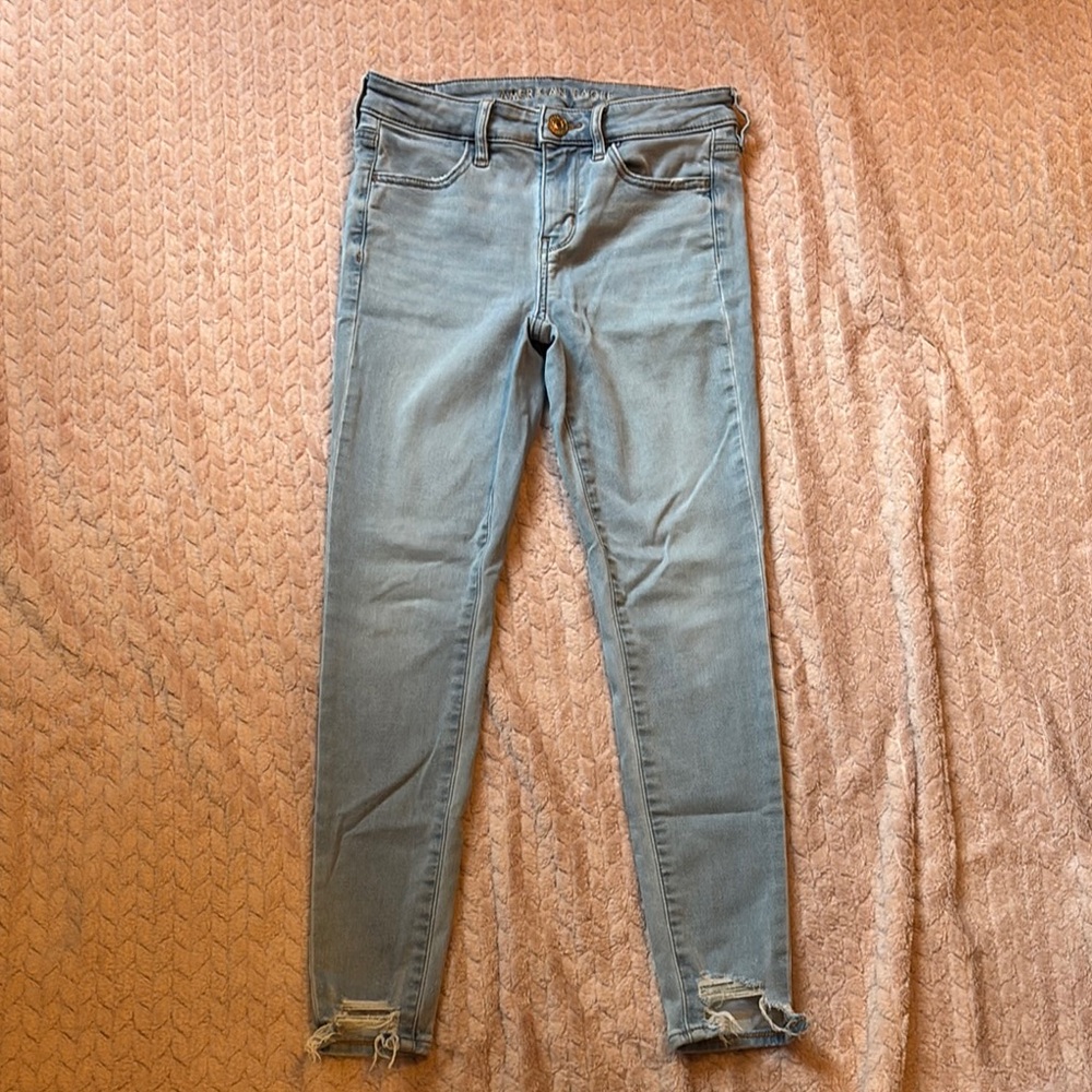 American Eagle Outfitters Blue Skinny Jeans with Distressed Hem